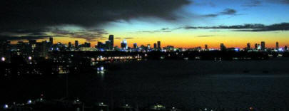 Rob Jones with the Miami skyline and coastal environment.
